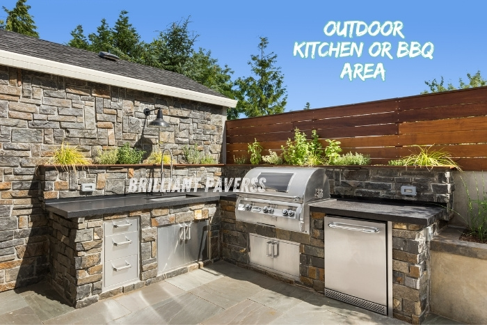 Stylish outdoor kitchen and BBQ area with stone paver flooring installed by Brilliant Paverss in Coimbatore